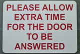 Please Allow Extra Time for the Door to be Answered Sign Plaque in White Background with Red Text