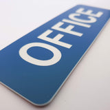 Blue sign with 'OFFICE' text on a white background