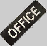 Black sign with 'OFFICE' in white on a light gray background