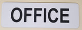 White sign with 'OFFICE' in black text on a beige background