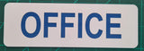 Rectangular sign with Blue 'OFFICE' text on a green cutting mat