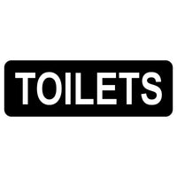 Black rectangular sign with 'TOILETS' text on a white background