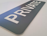 Sign with 'PRIVATE' text on a surface