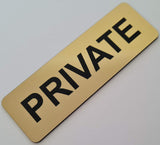 Gold sign with 'PRIVATE' in Black text on a light gray background