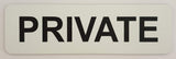 Rectangular White sign with Black 'PRIVATE' text on a light background