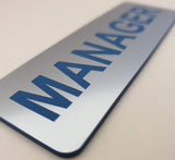 Metallic Silver acrylic sign with Blue text 'MANAGER'