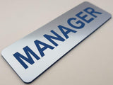 Metallic Silver acrylic sign with Blue text 'MANAGER'