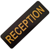 Black acrylic sign with Gold engraved text 'RECEPTION'