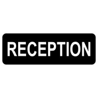Black Rectangular sign with white text 'RECEPTION'