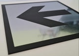 Silver acrylic Sign with a Black engraved arrow symbol