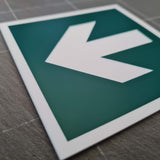 Ever Green acrylic sign with a white engraved directional arrow