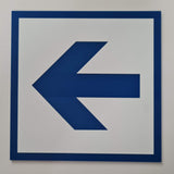 Engraved Blue arrow on a white acrylic sign