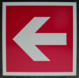 Red square sign with a white engraved directional arrow