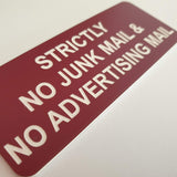 Burgundy acrylic sign with White engraved text