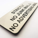 Rectangular Almond acrylic sign with Black engraved text 'Strictly No Junk Mail & No Advertising' on a white background