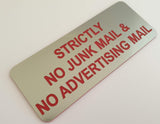 Metallic Silver acrylic sign with red engraved text 'Strictly No Junk Mail & No Advertising Mail' on a light background