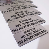 Silver acrylic sign with Black Engraved text "STRICTLY NO JUNK MAIL & NO ADVERTISING MAIL"