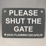 Please Shut the Gate Dog Planning Escape Sign Plaque in Smoke Grey with White Engraving