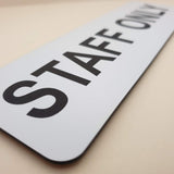 Rectangular White sign with 'STAFF ONLY' in Black text