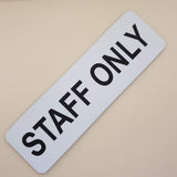Rectangular White sign with 'STAFF ONLY' in Black text