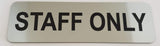 Silver sign with Black Text 'STAFF ONLY' on a white background