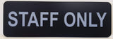 Black sign with Silver text 'STAFF ONLY' on a white background