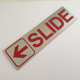 SLIDE WITH LEFT ARROW GRAPHIC Sign / Plaque