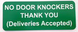 Green sign with white text indicating 'No Door Knockers Thank You (Deliveries Accepted)' on a white background.