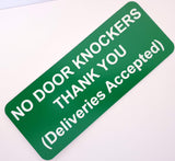 Green sign with white text on a white background