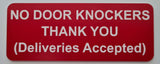 Red sign with white text on a gray background