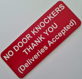 Red sign with white text on a light gray background