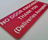 Red sign with white text on a white background