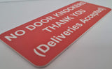 Orange sign with white text on a white background