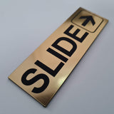 SLIDE WITH RIGHT ARROW GRAPHIC Sign / Plaque
