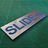 SLIDE WITH RIGHT ARROW GRAPHIC Sign / Plaque