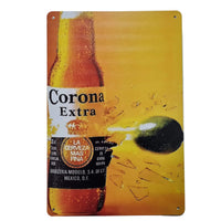Metal sign with Corona Extra beer bottle and lime on a yellow background