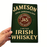 Hand holding a Jameson Irish Whiskey sign with a green background