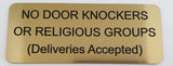 Gold sign with black text on a white background