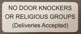 Sign on a tiled wall reading 'NO DOOR KNOCKERS OR RELIGIOUS GROUPS (Deliveries Accepted)'