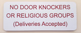 White sign with red text on a beige background