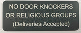 Sign on a door indicating 'No door knockers or religious groups (deliveries accepted)'