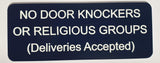 Sign on a door indicating 'No door knockers or religious groups, deliveries accepted'.