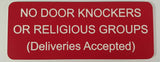 Red sign with white text on a gray background
