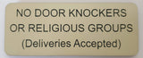 Beige sign with black text on a white background