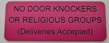 Pink sign with black text on a white background