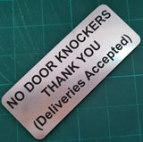 Silver background with text 'NO DOOR KNOCKERS THANK YOU (Deliveries Accepted)'.