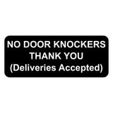 Black sign with white text 'NO DOOR KNOCKERS THANK YOU (Deliveries Accepted)' on a white background