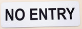 White sign with Black Text 'NO ENTRY' on a beige background