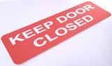 Orange acrylic sign with white text 'KEEP DOOR CLOSED'