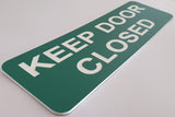 Celadon Green acrylic sign with White text 'KEEP DOOR CLOSED'